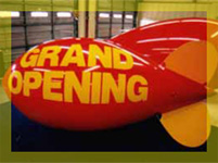 11ft blimp with Grand Opening lettering